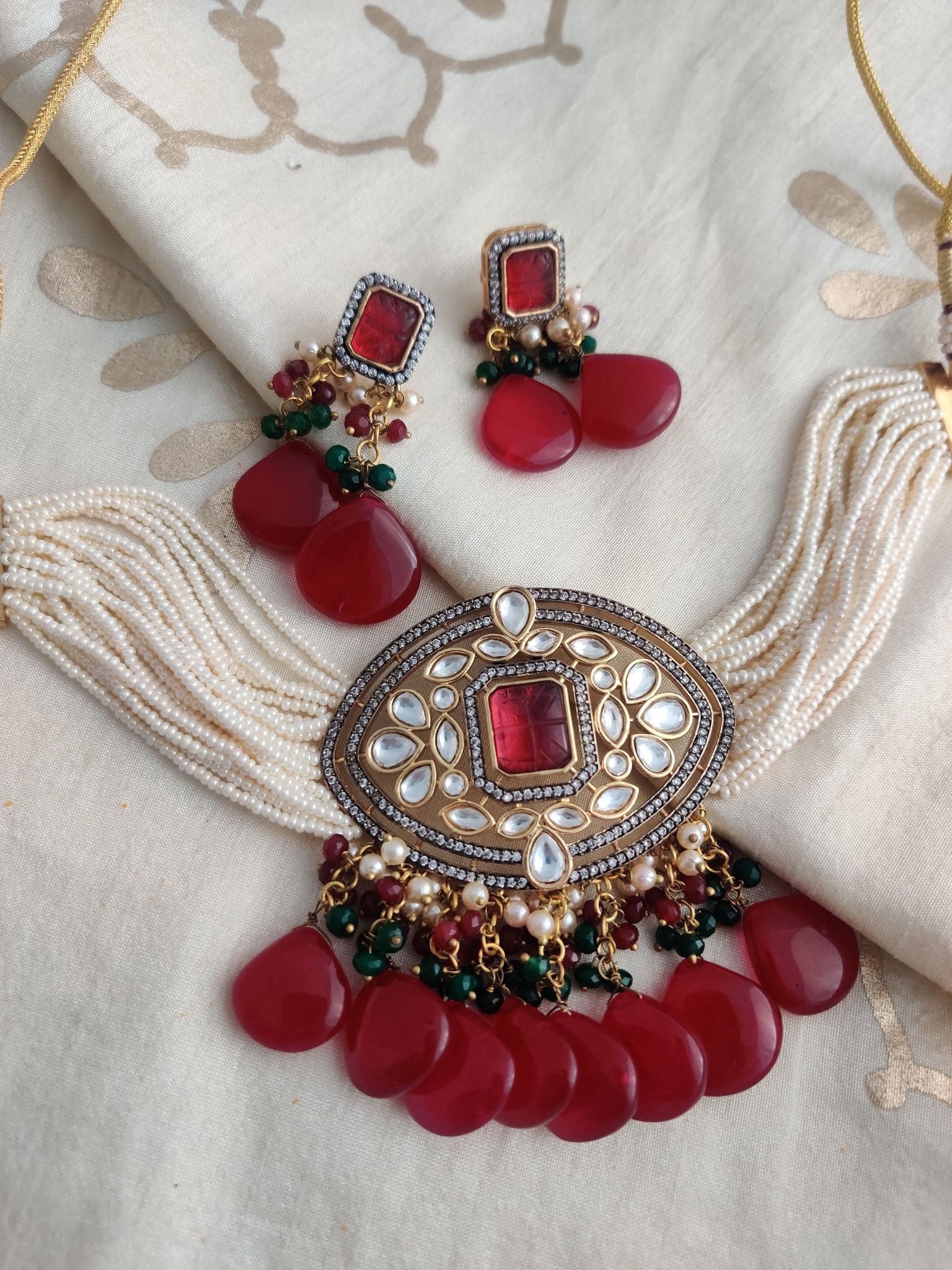 Binni's Wardrobe  Gold plated kundan set with hanging red stone